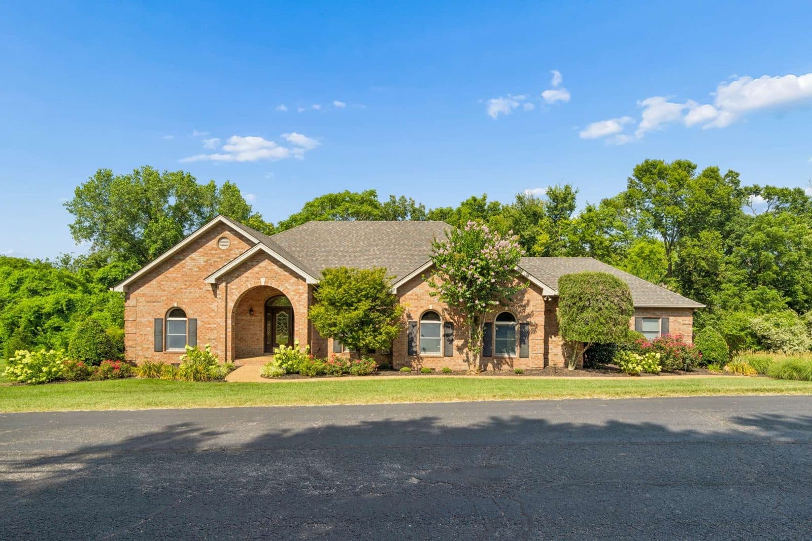 Street facing front exterior of the brick house at 770 Peach Orchard Dr, one of the Oak Hill homes for sale in Oak Hill Nashville