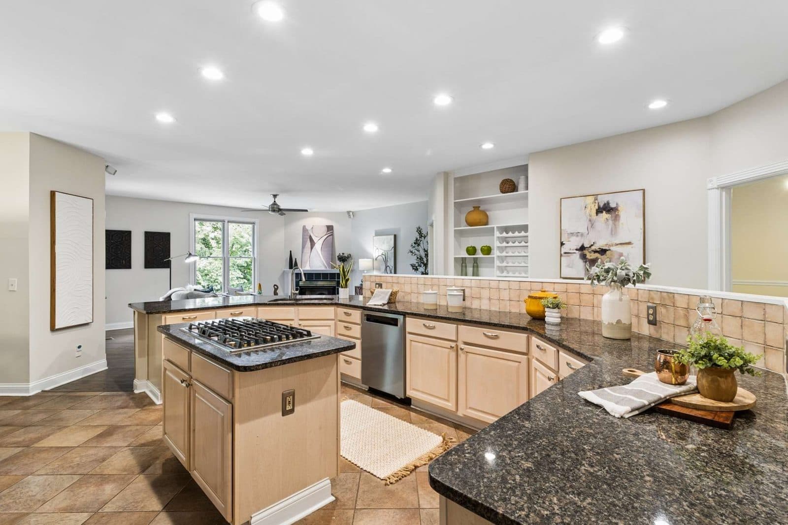 Kitchen with an island and wood cabinets at 770 Peach Orchard Dr, Oak Hill Nashville
