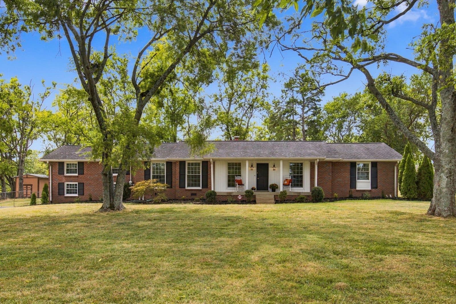 Street facing front exterior of the brick ranch at 721 Lambert Dr, one of the Oak Hill homes for sale in Oak Hill Nashville