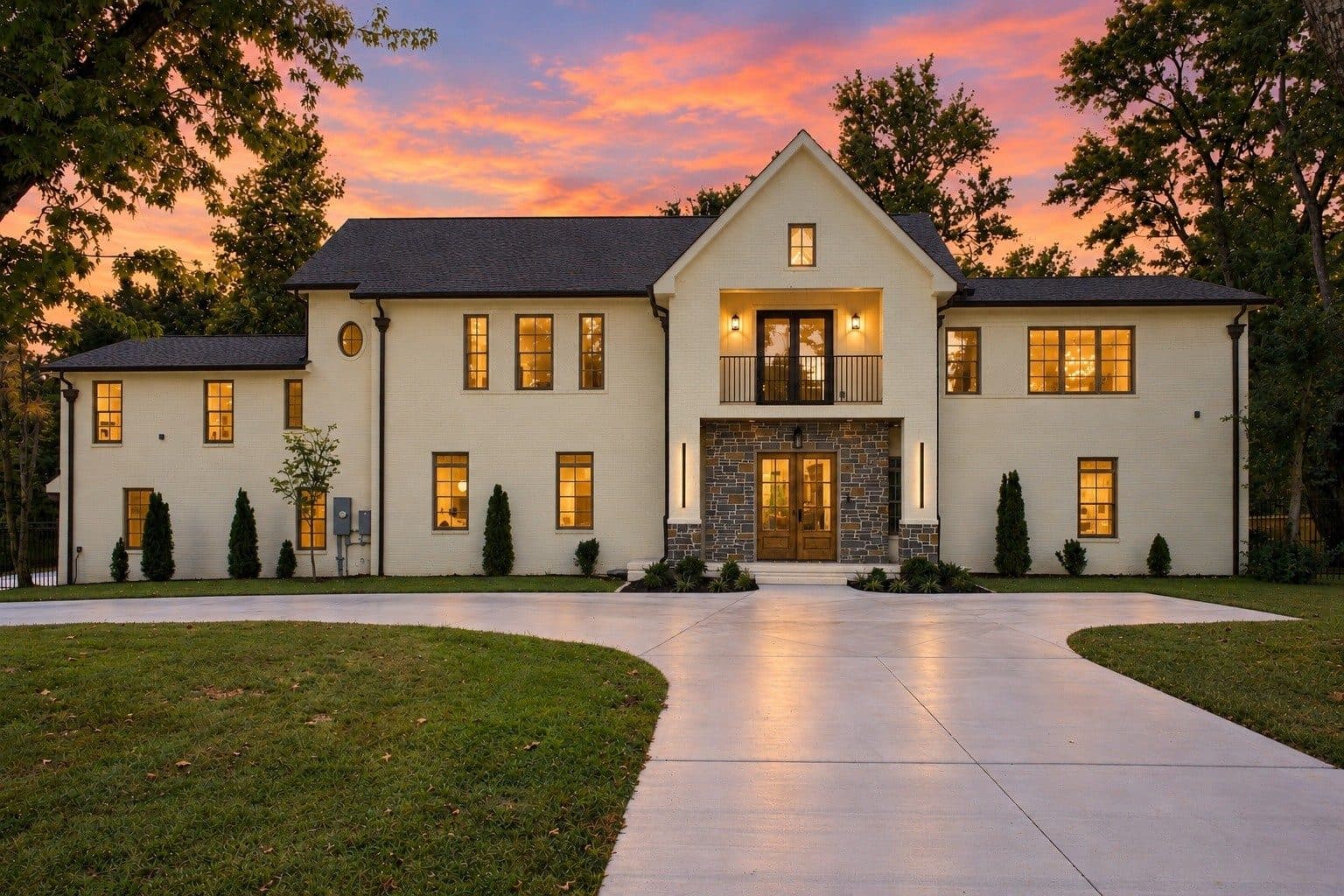Street facing front exterior of the light brick house at 701 Brindley Dr, one of the Oak Hill homes for sale in Oak Hill Nashville