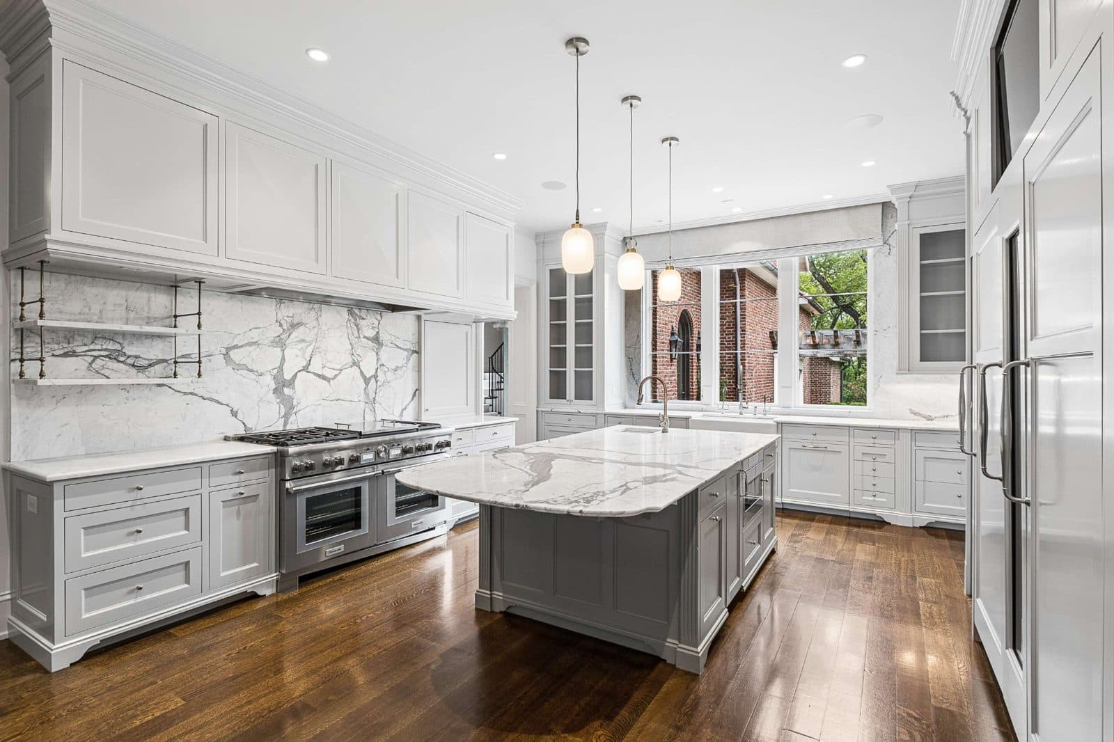 Kitchen with a large island, wood cabinets, and a range at 4316 Franklin Pike, Oak Hill Nashville