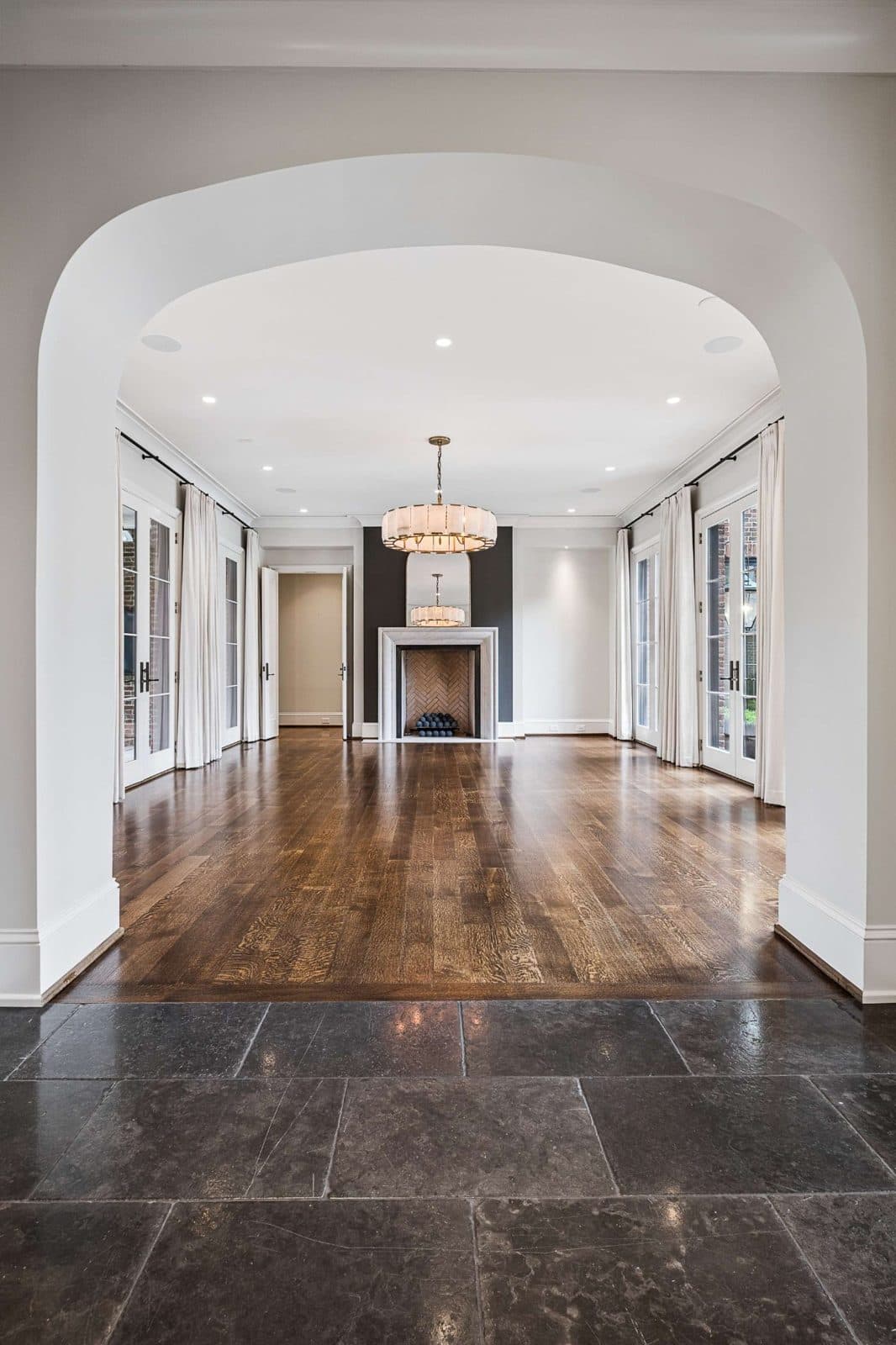 Primary bedroom with a fireplace and an arched doorway at 4316 Franklin Pike, Oak Hill Nashville